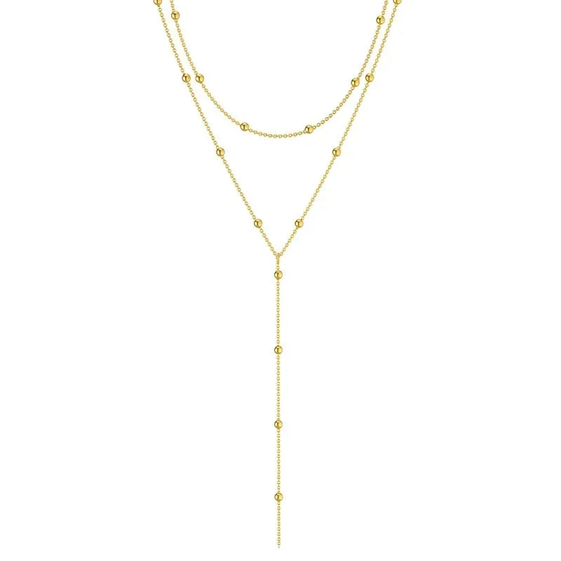 LuxeTassel Necklace – Double Layer Chain Choker  Layered shine. Flowing detail. Effortless elegance.