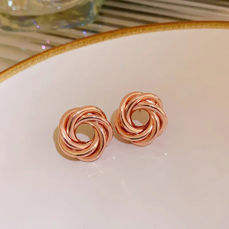 Twist Aura Hoops – Multi-Layer Geometric Earrings  Layered design. Bold shine. Modern elegance.