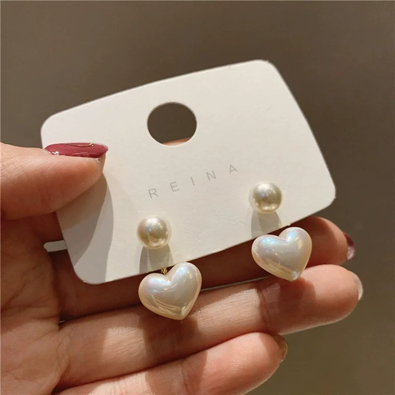 Heart Pearl Studs – Elegant Korean Love Earrings  Soft shine. Sweet charm. Timeless romance.