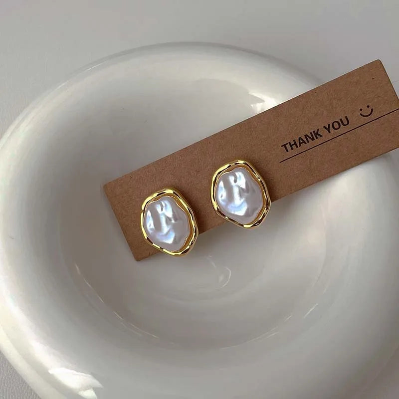 PearlEdge Studs – Irregular Metal Pearl Earrings  Classic pearls. Modern shape. Effortless elegance.