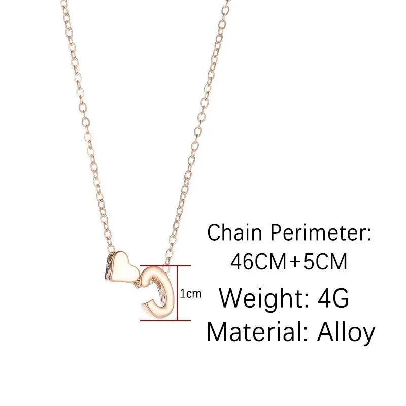 InitialCharm Necklace – Tiny Heart Letter Choker  Personal touch. Delicate shine. Meaningful style.