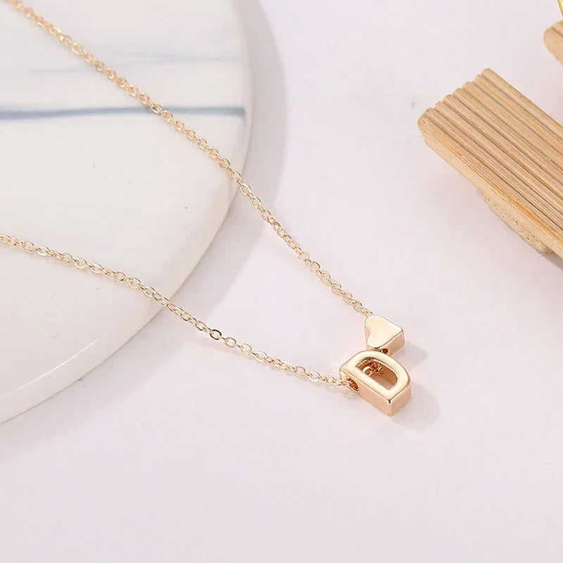 InitialCharm Necklace – Tiny Heart Letter Choker  Personal touch. Delicate shine. Meaningful style.