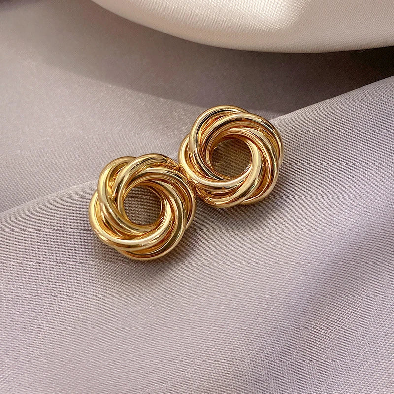 Twist Aura Hoops – Multi-Layer Geometric Earrings  Layered design. Bold shine. Modern elegance.