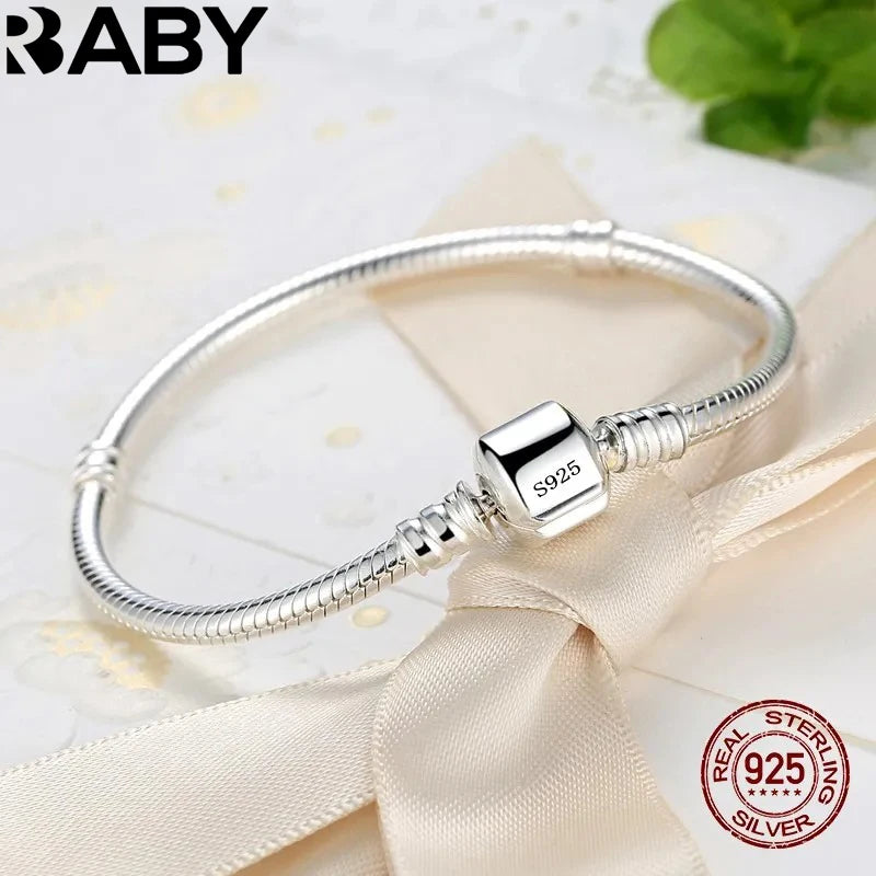 Silver Serpent Charm Bracelet – 925 Sterling Silver  Pure silver. Smooth feel. Timeless elegance.