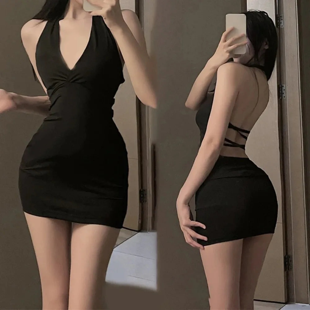Midnight Wrap Mini Dress – Halter Backless V-Neck  Sleek black. Sculpted fit. Made for the spotlight.