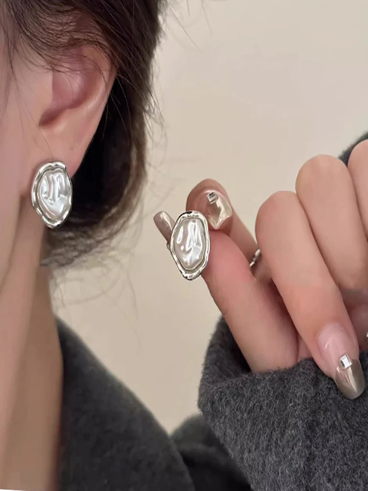PearlEdge Studs – Irregular Metal Pearl Earrings  Classic pearls. Modern shape. Effortless elegance.