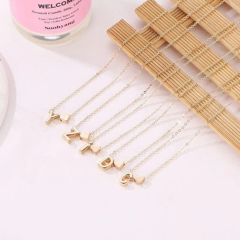 InitialCharm Necklace – Tiny Heart Letter Choker  Personal touch. Delicate shine. Meaningful style.