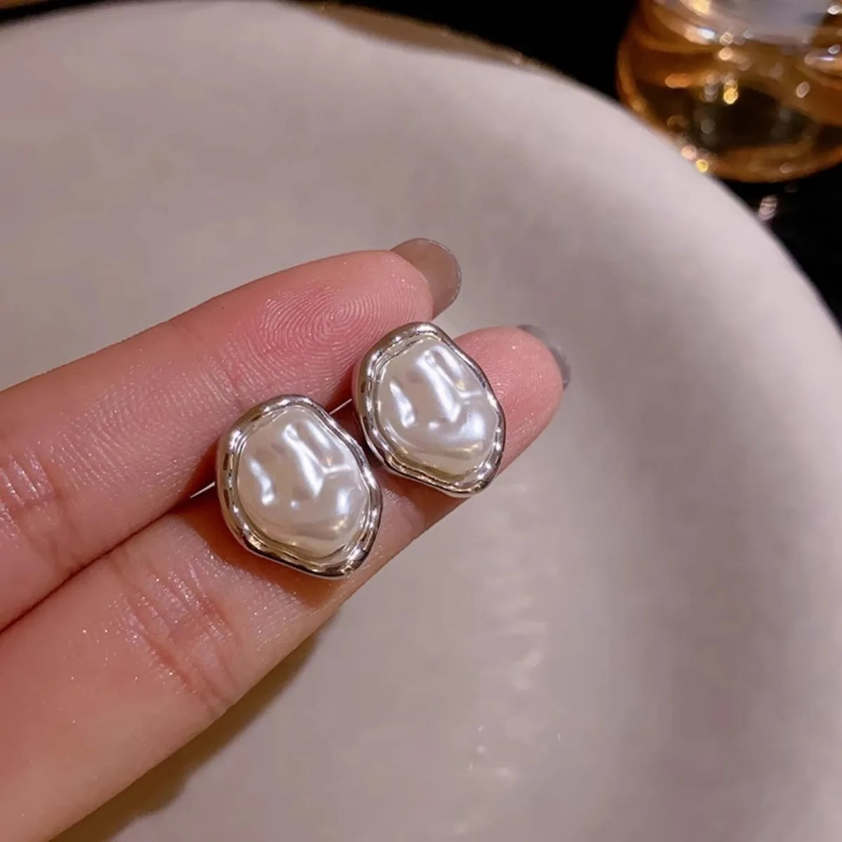 PearlEdge Studs – Irregular Metal Pearl Earrings  Classic pearls. Modern shape. Effortless elegance.