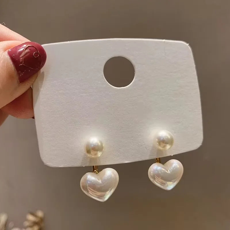 Heart Pearl Studs – Elegant Korean Love Earrings  Soft shine. Sweet charm. Timeless romance.