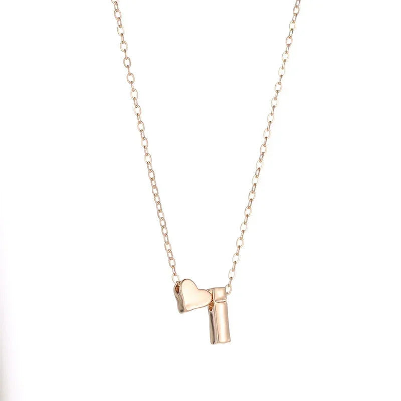 InitialCharm Necklace – Tiny Heart Letter Choker  Personal touch. Delicate shine. Meaningful style.