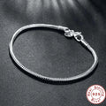 Silver Serpent Charm Bracelet – 925 Sterling Silver  Pure silver. Smooth feel. Timeless elegance.