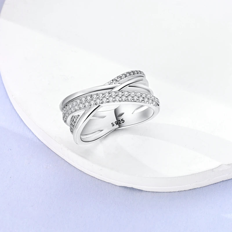 InfinityTwist Ring – 925 Silver Zircon Band  Elegant lines. Timeless shine. A symbol of forever.
