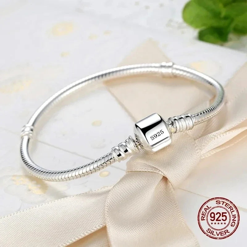 Silver Serpent Charm Bracelet – 925 Sterling Silver  Pure silver. Smooth feel. Timeless elegance.