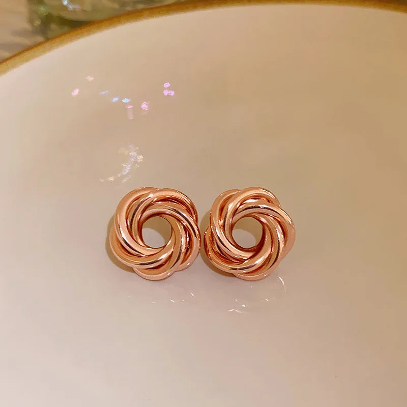 Twist Aura Hoops – Multi-Layer Geometric Earrings  Layered design. Bold shine. Modern elegance.
