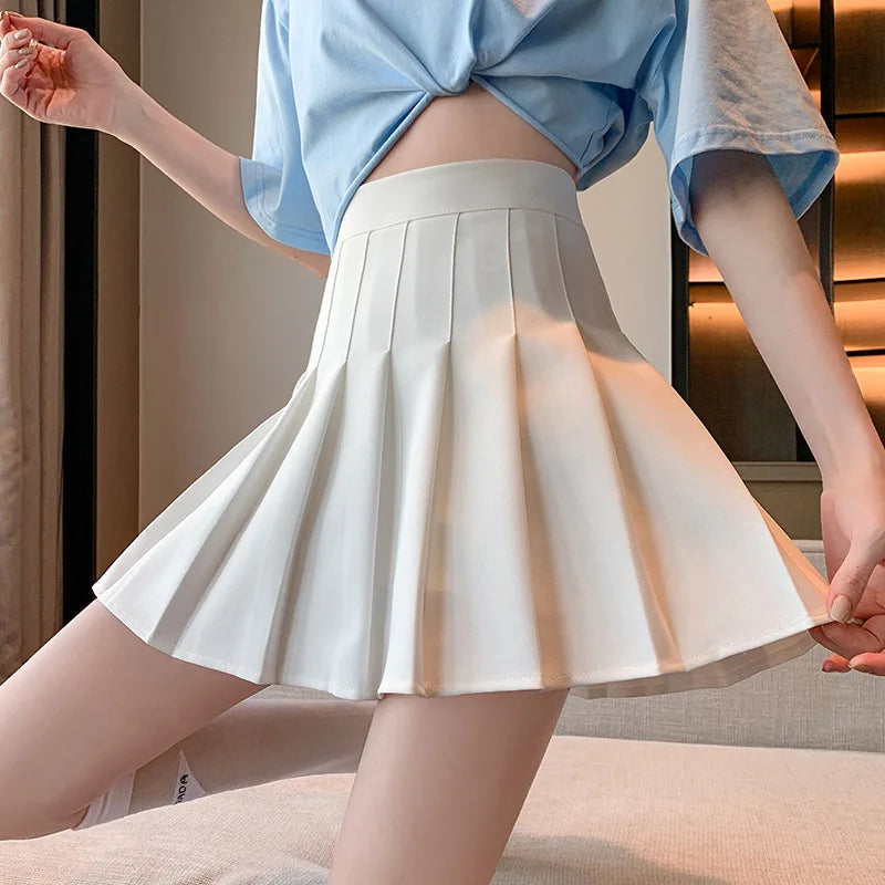 ClassyPleat Mini Skirt – High-Waist JK A-Line Style  Playful pleats. Flattering fit. Timeless vibe.