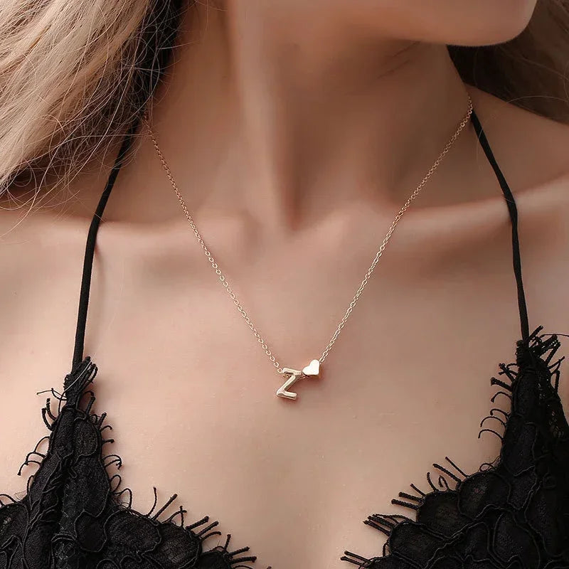 InitialCharm Necklace – Tiny Heart Letter Choker  Personal touch. Delicate shine. Meaningful style.
