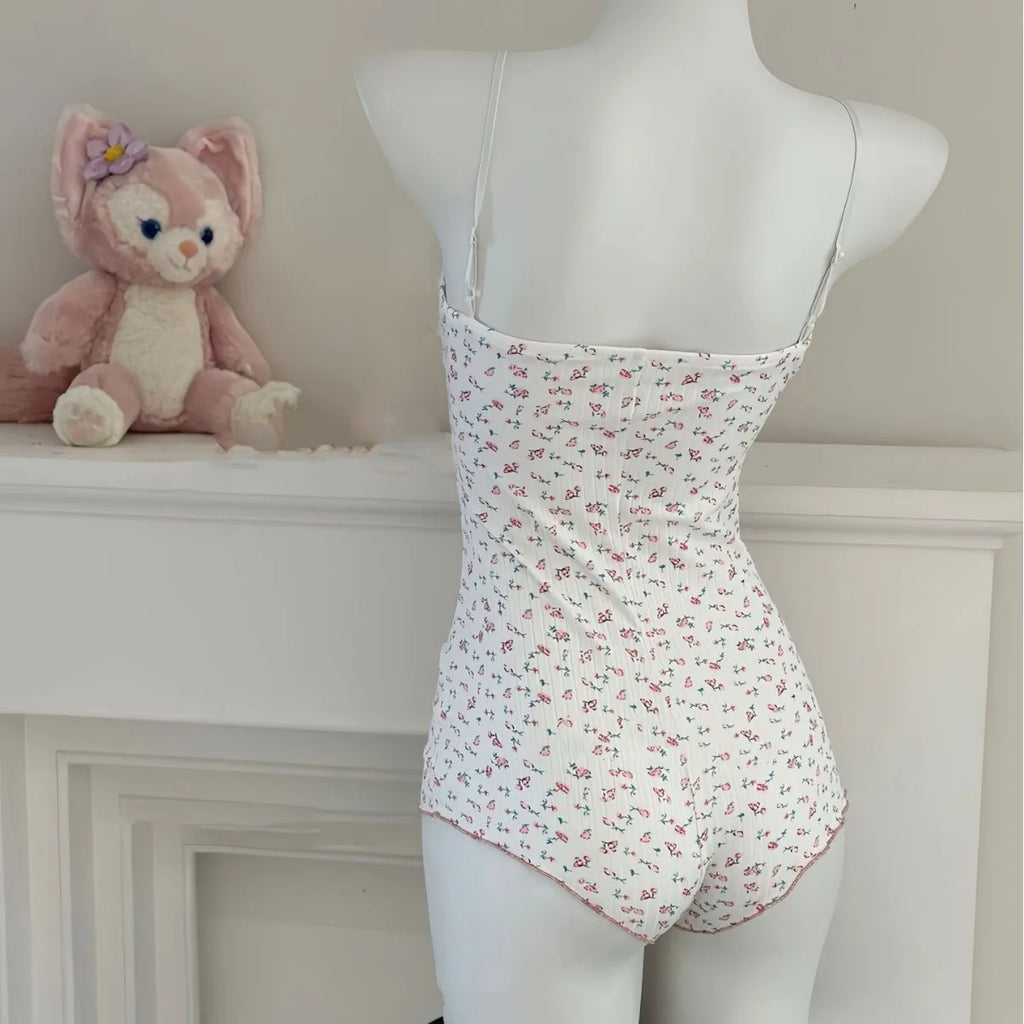 FloraLace Bodysuit – Floral Print Sleeveless Fit  Soft lace. Floral charm. Effortless allure.